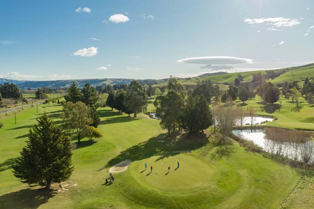 Taieri Lakes Golf Course An aerial shot of a group of golfers on Taieri Lakes Golf Course.